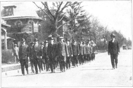 EFFECT OF THIRTY DAYS OF TRAINING UPON A COMPANY. THESE
MEN ARE CARRYING IRON BARS WEIGHING NINE POUNDS EACH