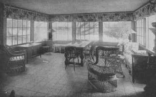 A glassed-in sun-porch furnished with comfortable wicker
furniture adds much to the joy of life.