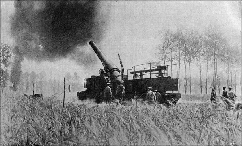 A British "Heavy" Mounted on a Railway-Truck Shelling the German Lines.