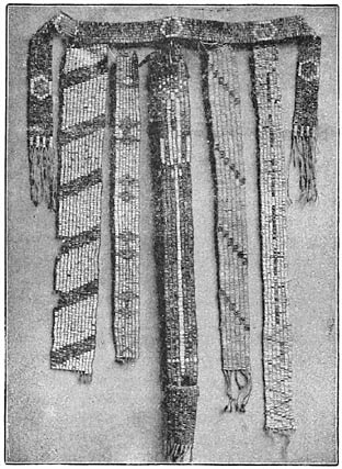 Fig. 2&mdash;Ancient Iroquois wampum belts.&ldquo;The Onondagas retain the custody of the wampums of the Five Nations, and the keeper of the wampums, Thomas Webster, of the Snipe tribe, a consistent, thorough pagan, is their interpreter. Notwithstanding the claims made that the wampums can be read as a governing code of law, it is evident that they are simply monumental reminders of preserved traditions, without any literal details whatever. &ldquo;The first [of this] group from left to right, represents a convention of the Six Nations at the adoption of the Tuscaroras into the league; the second, the Five Nations, upon seven strands, illustrates a treaty with seven Canadian tribes before the year 1600; the third signifies the guarded approach of strangers to the councils of the Five Nations (a guarded gate, with a long, white path leading to the inner gate, where the Five Nations are grouped, with the Onondagas in the center and a safe council house behind all); the fourth represents a treaty when but four of the Six Nations were represented, and the fifth embodies the pledge of seven Canadian christianized nations to abandon their crooked ways and keep an honest peace (having a cross for each tribe, and with a zigzag line below, to indicate that their ways had been crooked but would ever after be as sacred as the cross). Above this group is another, claiming to bear date about 1608, when Champlain joined the Algonquins against the Iroquois.&rdquo;&mdash;Carrington, in Six Nations of New York, Extra Bulletin, Eleventh Census, pp. 33&ndash;34, 1892.